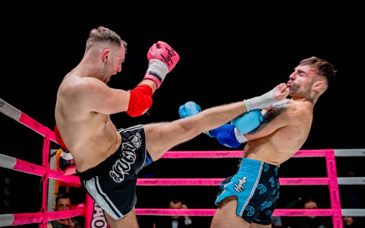Hayden throwing a head kick in the ring at the Hitman Fight League